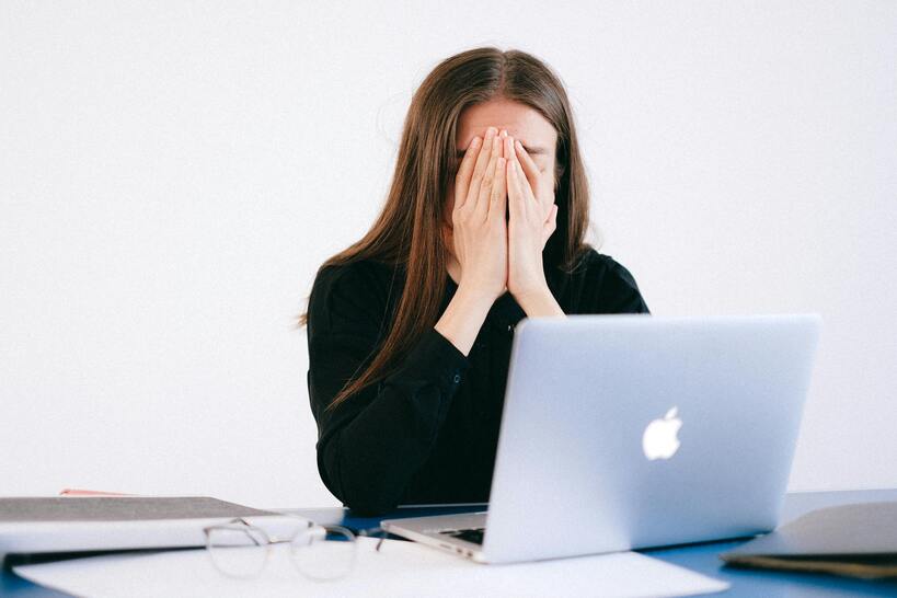 woman's hands and typing on laptop